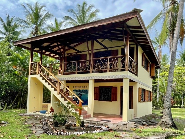 Outside of house, as seen from the beach side